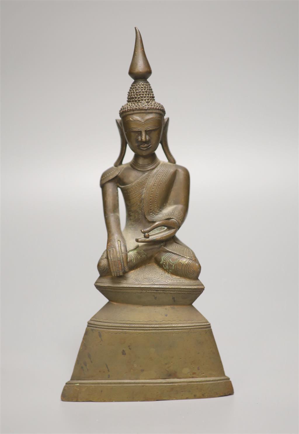 A 19th century Burmese bronze Buddha, height 24cm